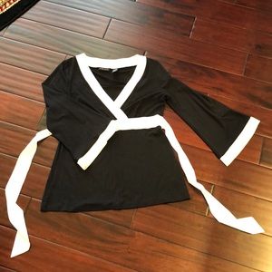 Black empire waist top, white silky trim and ties